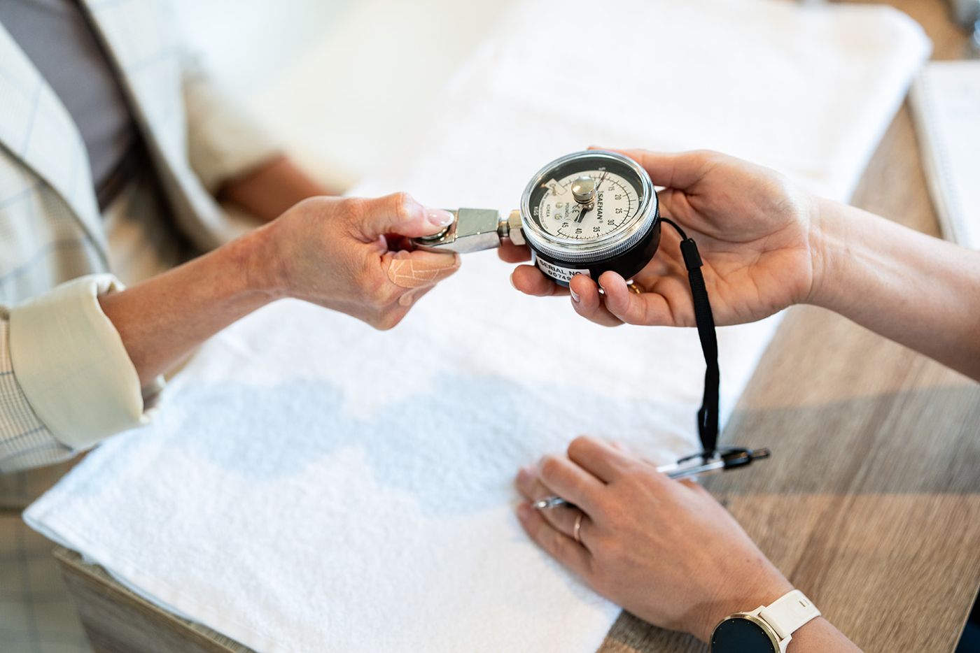 Grip strength being measured with a hand dynamometer